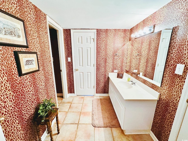 bathroom with vanity and tile patterned flooring