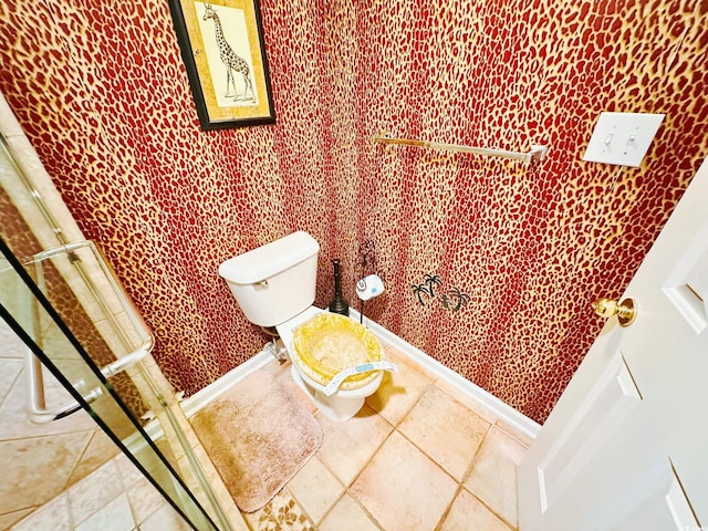 bathroom featuring tile patterned floors and toilet