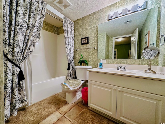 full bathroom with toilet, vanity, tile patterned flooring, shower / bathtub combination with curtain, and a textured ceiling