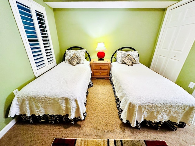 bedroom with a closet and carpet flooring