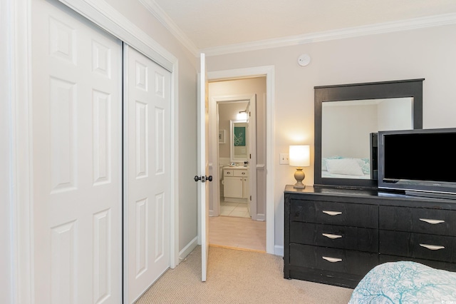 carpeted bedroom featuring a closet and ornamental molding