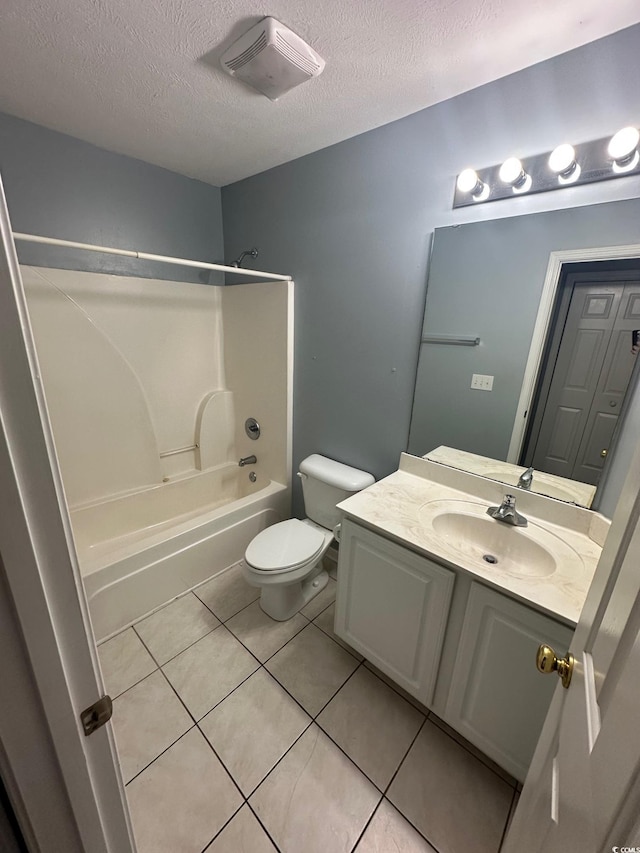 full bathroom featuring bathtub / shower combination, vanity, toilet, and a textured ceiling