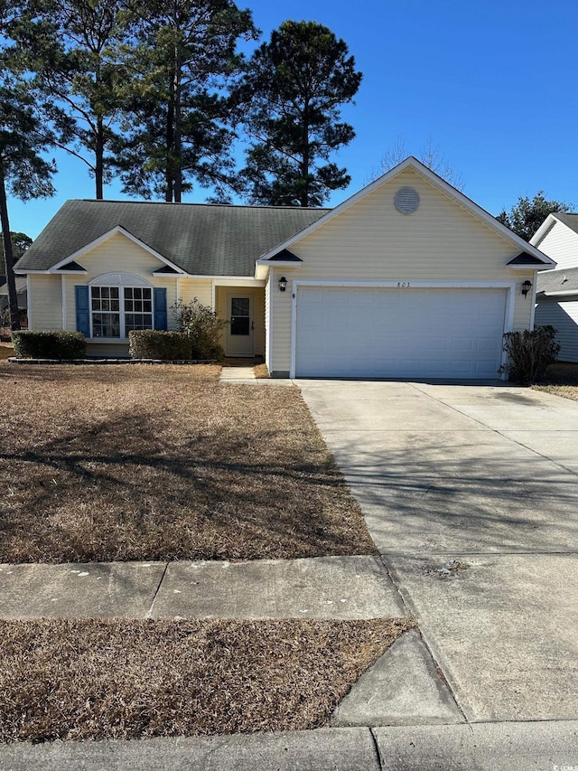 ranch-style home with a garage