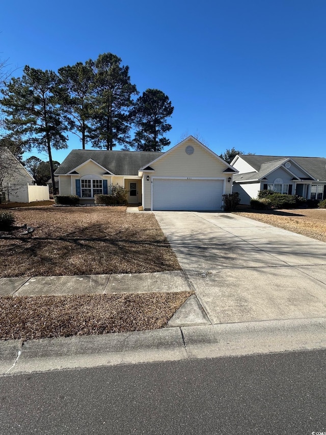 single story home featuring a garage