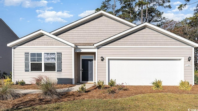 view of front of home featuring a garage and a front yard