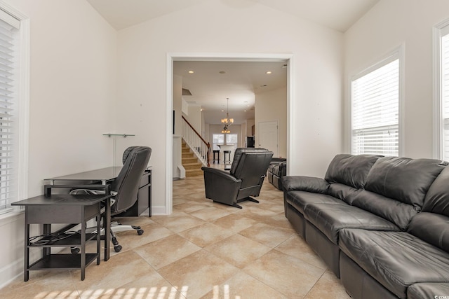 home office with light tile patterned floors, a chandelier, and vaulted ceiling