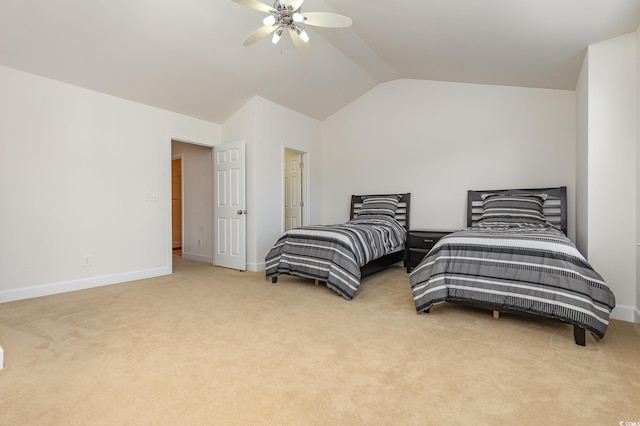 bedroom with ceiling fan, vaulted ceiling, and light carpet