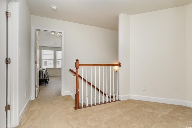 interior space featuring light carpet