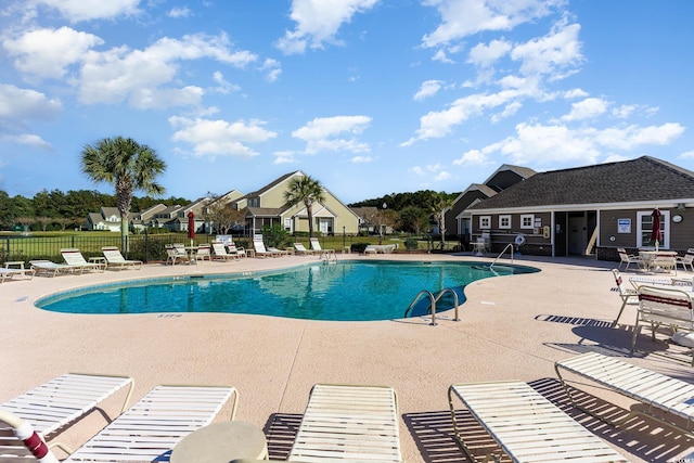 view of swimming pool with a patio