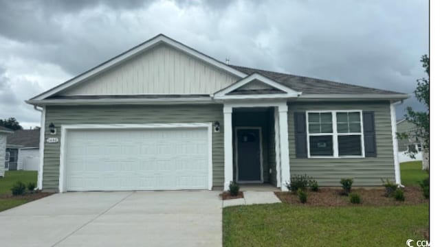 1480 Nokota Dr, Conway, SC 29526 - single story home with an attached garage, concrete driveway, and board and batten siding