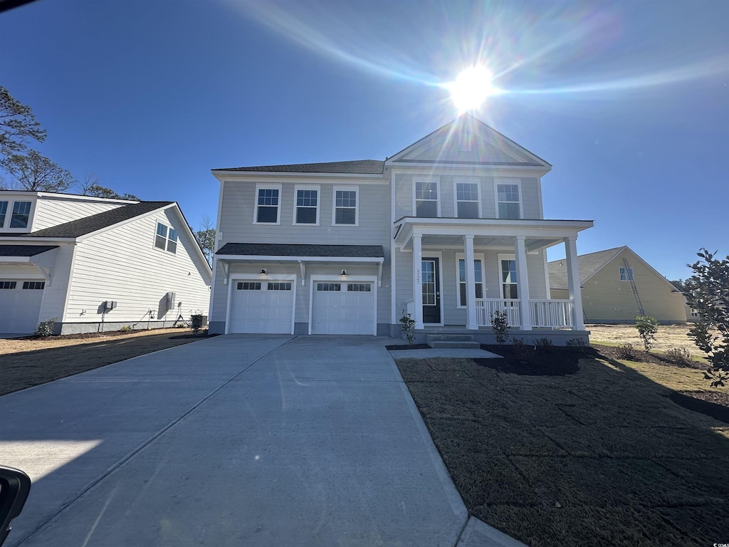 view of front of house with a garage and covered porch