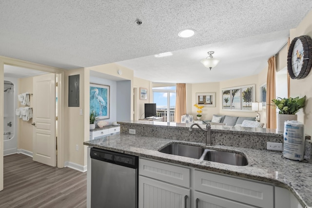 kitchen featuring sink, a textured ceiling, dark hardwood / wood-style flooring, dishwasher, and light stone countertops