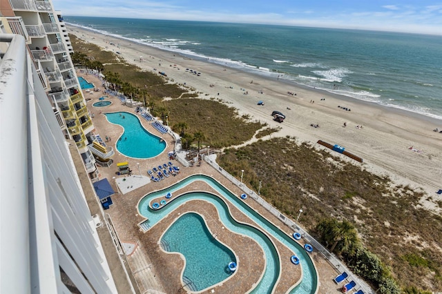 aerial view with a view of the beach and a water view