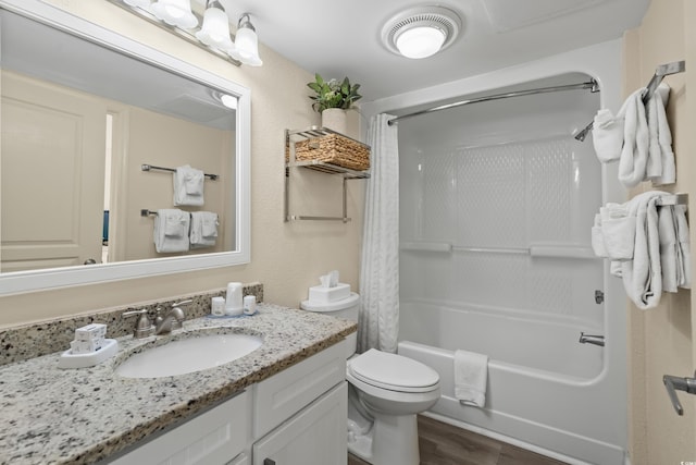 full bathroom featuring shower / tub combo with curtain, vanity, and toilet