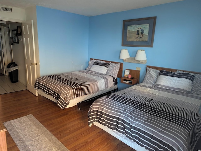 bedroom featuring hardwood / wood-style flooring