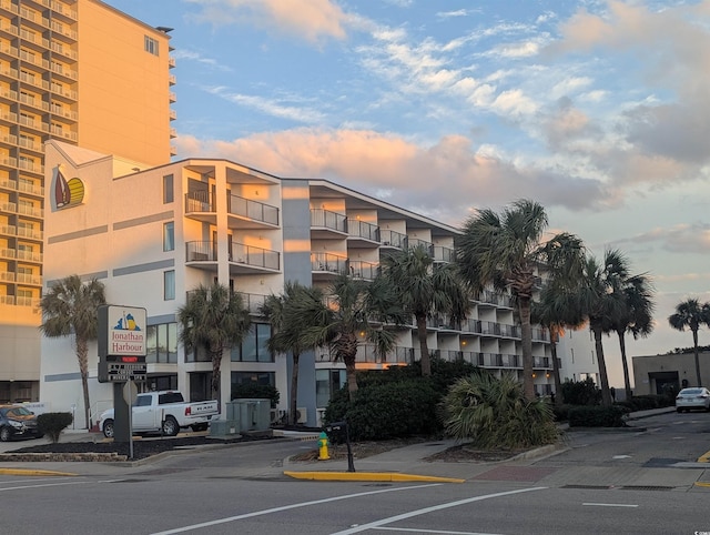 view of outdoor building at dusk