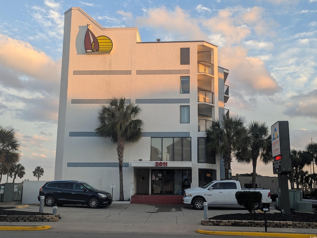 view of outdoor building at dusk