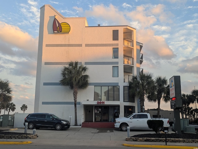 view of outdoor building at dusk