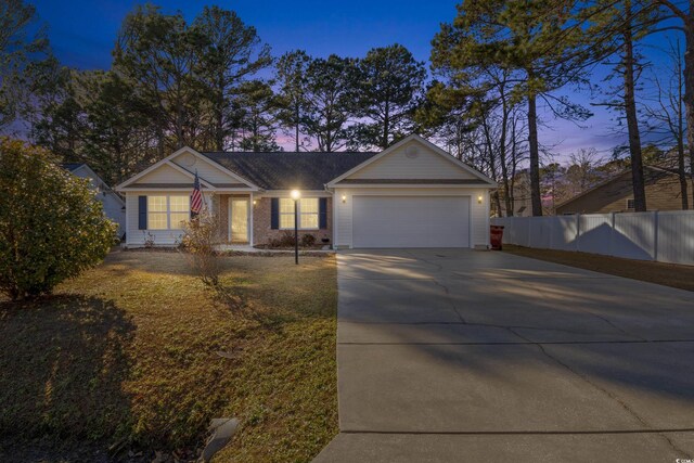 5933 Rahnavard Blvd, Myrtle Beach, SC 29588 - ranch-style house featuring fence, a front lawn, driveway, and an attached garage