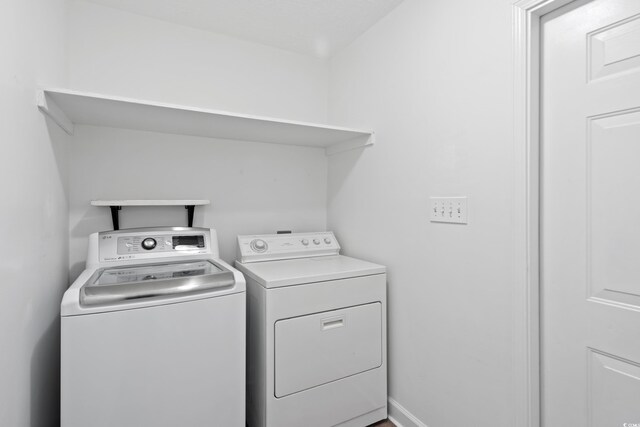 5933 Rahnavard Blvd, Myrtle Beach, SC 29588 - laundry room with washing machine and clothes dryer and laundry area