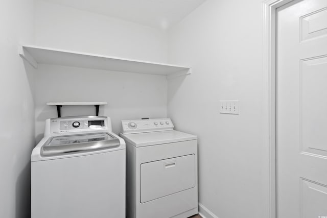 laundry room with washer and clothes dryer