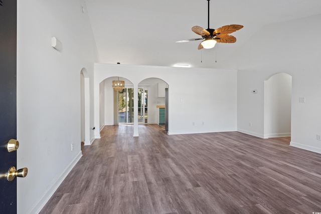 unfurnished living room with wood-type flooring, high vaulted ceiling, and ceiling fan