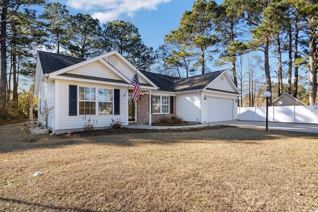 view of front facade with a garage and a front yard