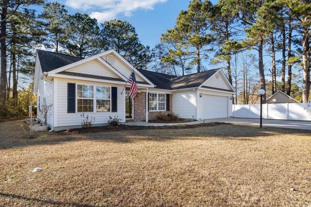 view of front facade with a garage and a front yard