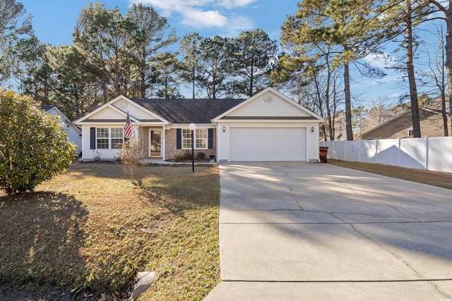 ranch-style home featuring a garage and a front yard