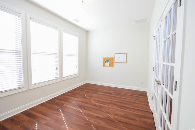 unfurnished room featuring dark wood-type flooring