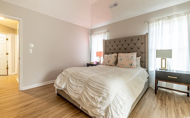 bedroom with wood-type flooring