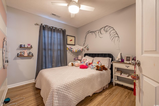 bedroom featuring ceiling fan and hardwood / wood-style flooring