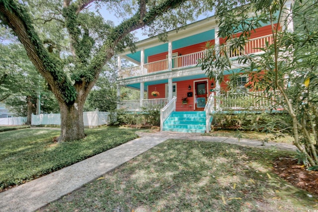 view of front of property with a front lawn and a porch