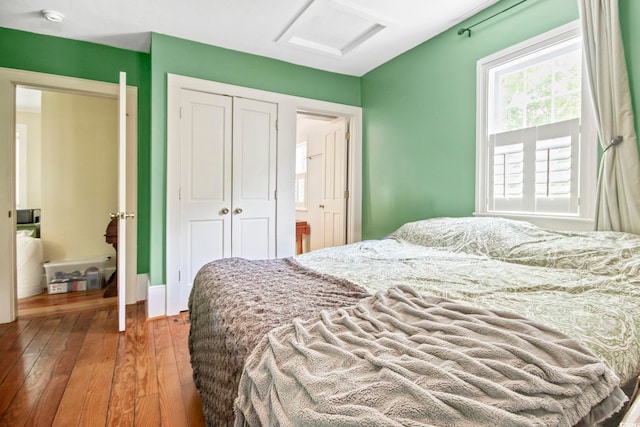 bedroom featuring a closet and wood-type flooring