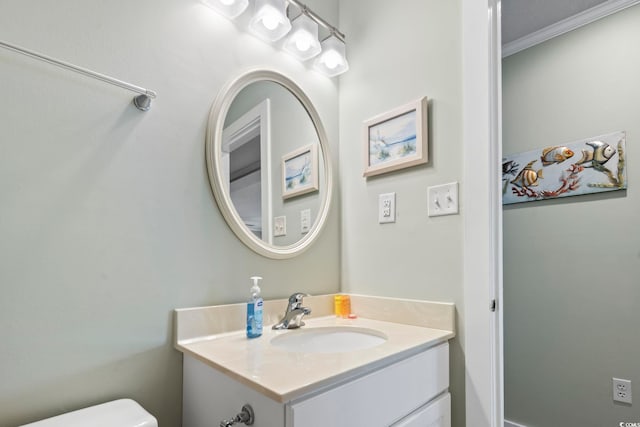 half bath with vanity and toilet