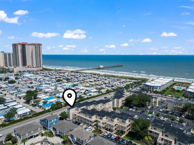 birds eye view of property with a view of city and a water view