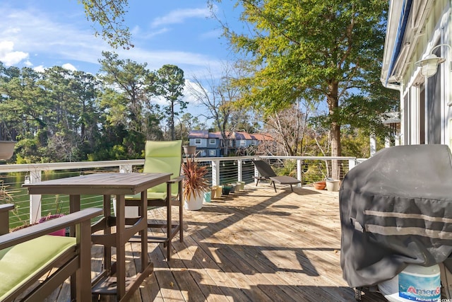 wooden terrace featuring area for grilling