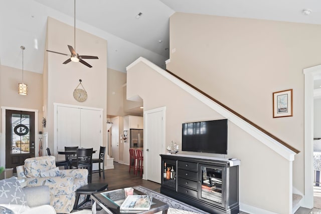 living room featuring high vaulted ceiling, ceiling fan, and dark hardwood / wood-style flooring