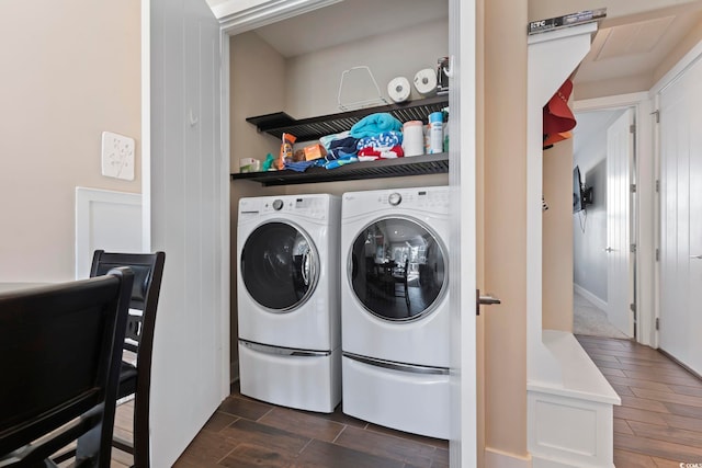 clothes washing area with washer and clothes dryer