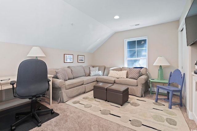 office space featuring lofted ceiling and light carpet