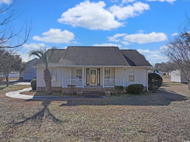 ranch-style home with a garage and covered porch