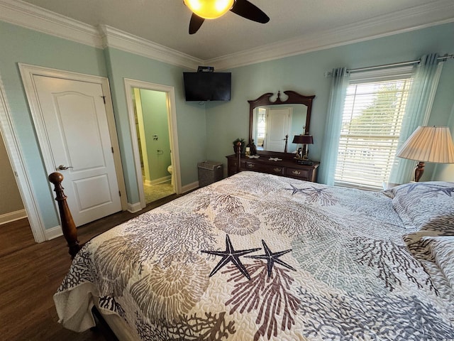 bedroom featuring crown molding, dark hardwood / wood-style floors, ensuite bath, and ceiling fan