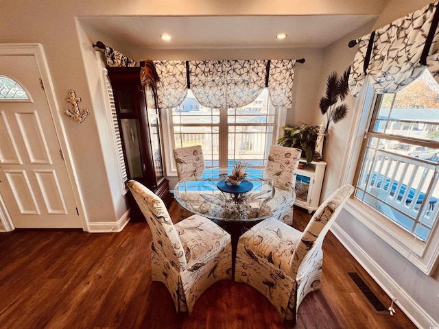 dining area featuring dark hardwood / wood-style flooring