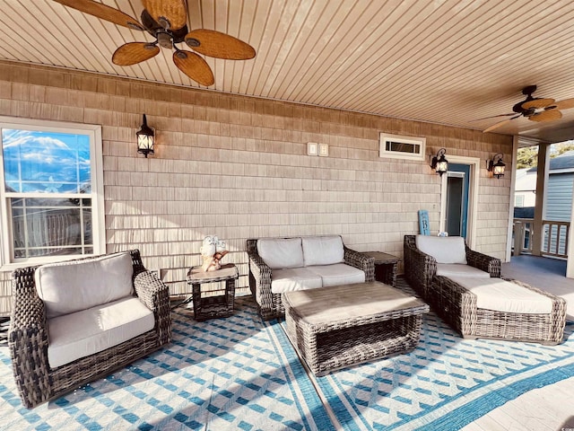 view of patio featuring ceiling fan and an outdoor living space