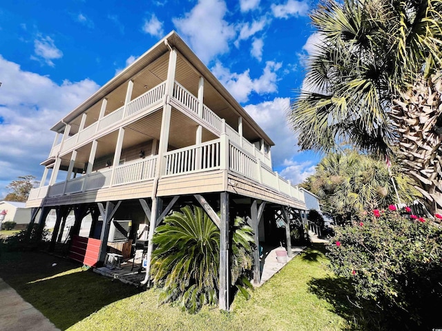 view of property exterior with a balcony and a yard