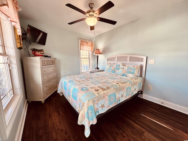 bedroom featuring ceiling fan and dark hardwood / wood-style floors