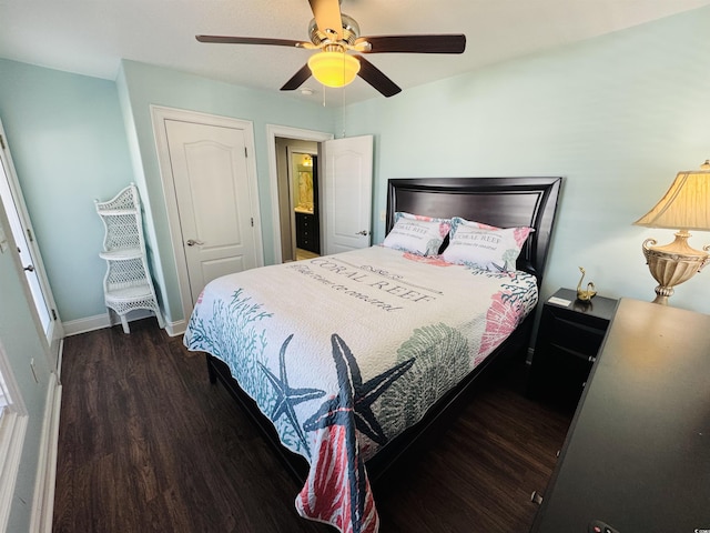 bedroom with ceiling fan and dark wood-type flooring