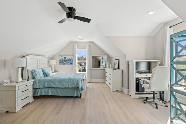 bedroom featuring vaulted ceiling, ceiling fan, and light wood-type flooring