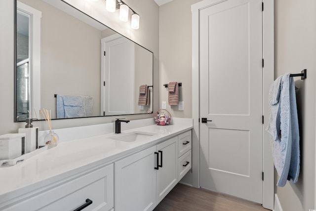 bathroom featuring vanity and wood-type flooring