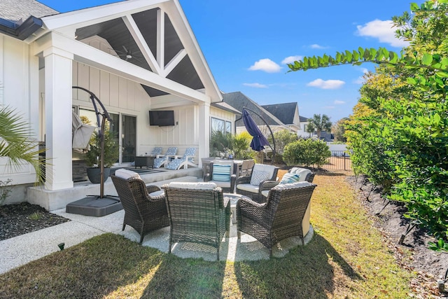 view of patio featuring outdoor lounge area and ceiling fan